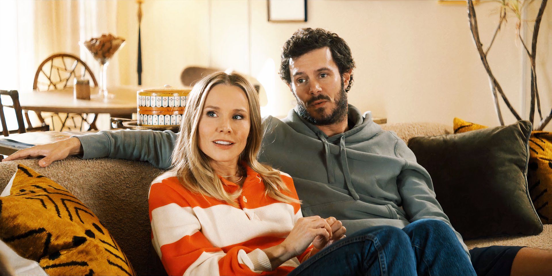 Adam Brody and Kristen Bell on the couch in Nobody Wants This