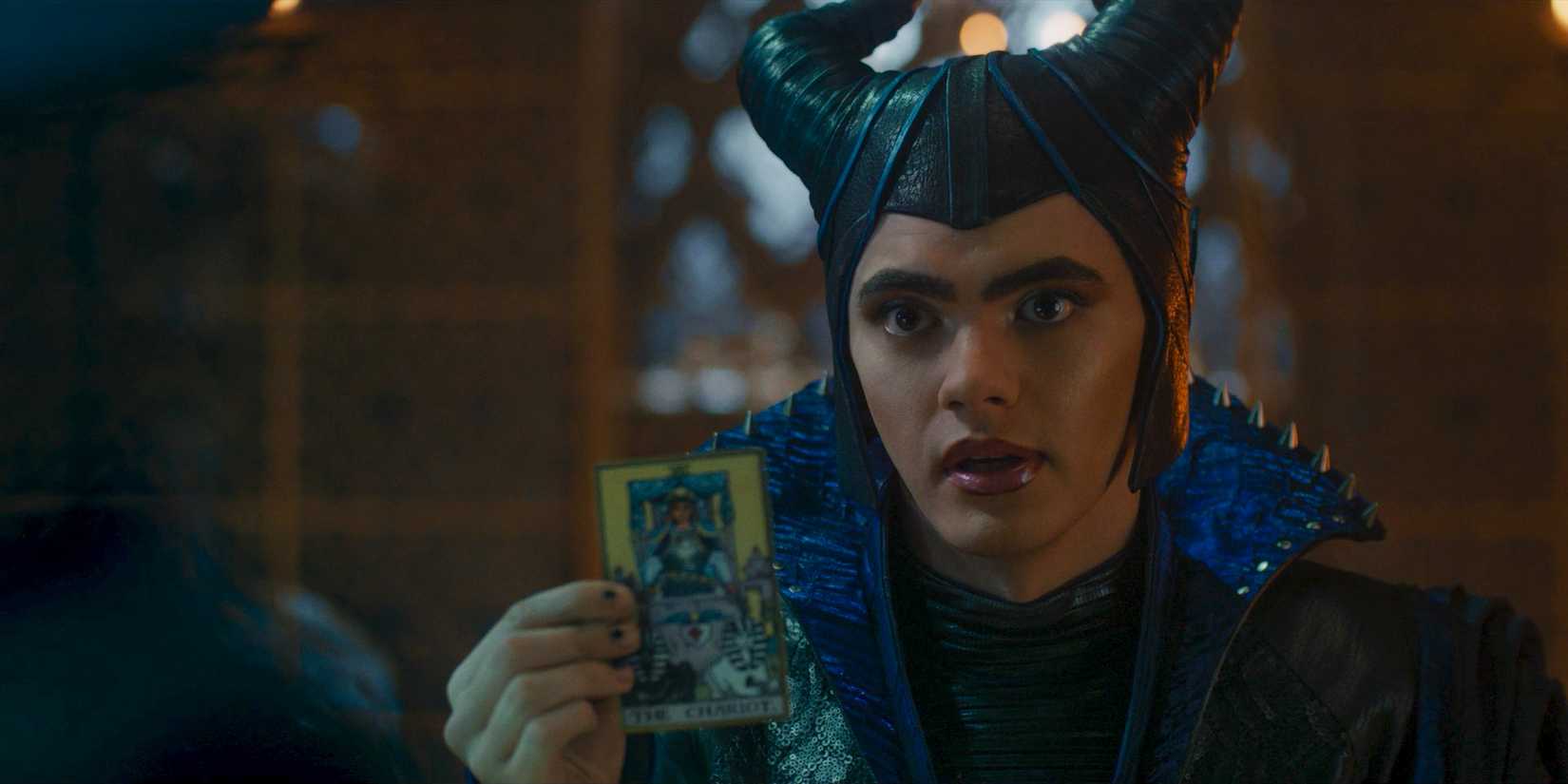 Billy (Joe Locke) showing a tarot card in Agatha All Along Season 1 Episode 7