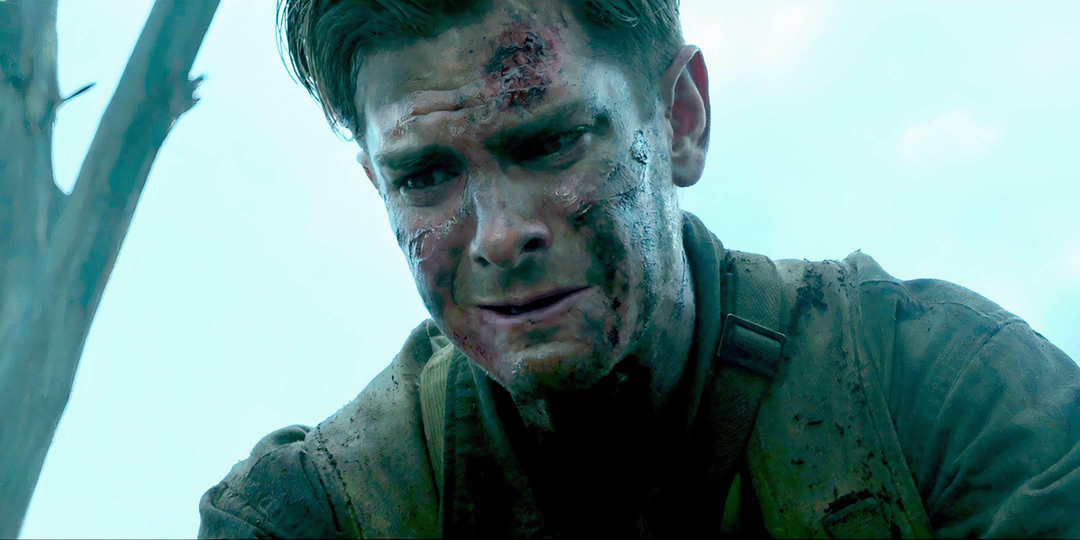 Andrew Garfield as Desmond crying over someone in the battlefield in Hacksaw Ridge