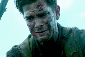 Andrew Garfield as Desmond crying over someone in the battlefield in Hacksaw Ridge