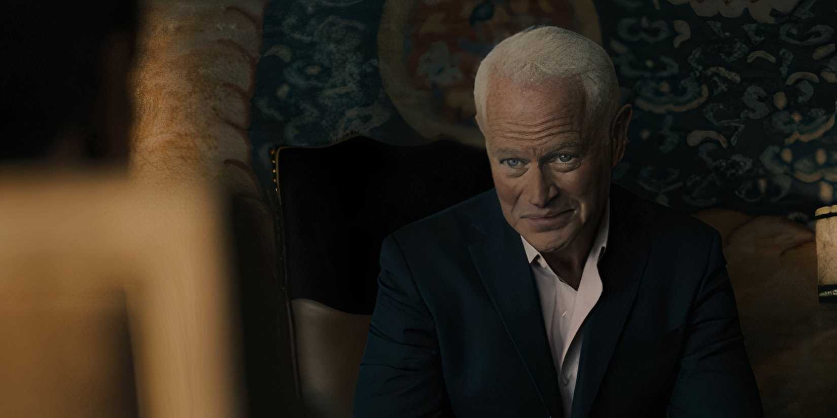 Cal Thresher (Neal McDonough) smiling mischievously in Tulsa King season 2, episode 6