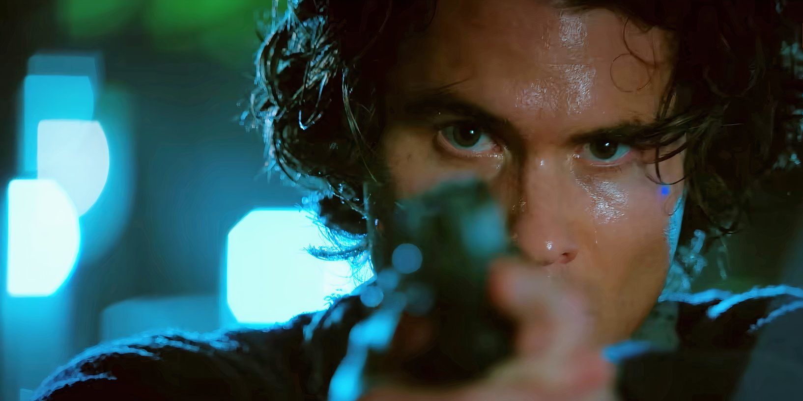 Chase Stokes as John B aiming a gun in Outer Banks season 4 