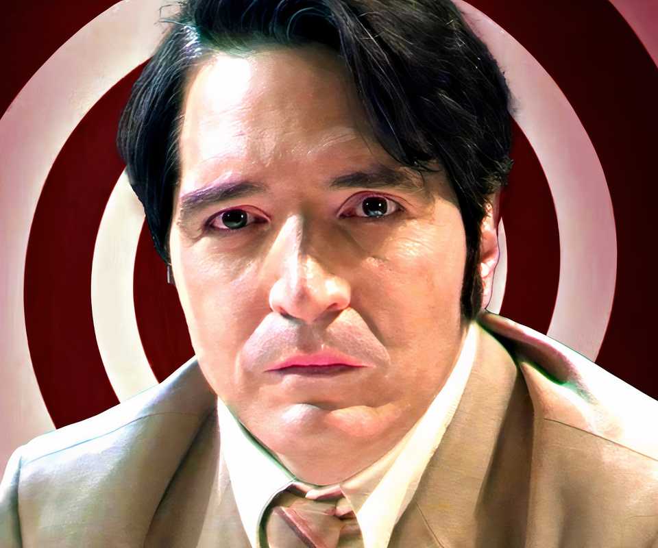 David Dastmalchian as Jack looking distraught against backdrop of hypnosis spiral in Late Night with the Devil