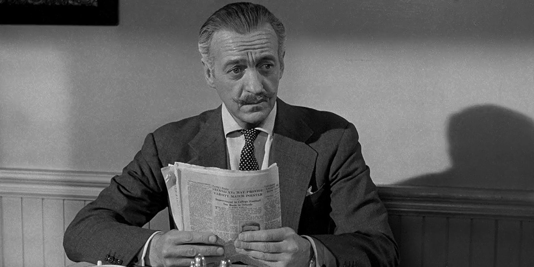 David Niven reading a newspaper in Separate Tables