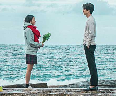 Gong Yoo standing next to the ocean in Goblin