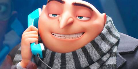 Gru smiling while on a prison phone in Despicable Me 4