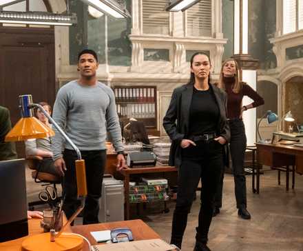 The cast of FBI International standing in their Budapest headquarters