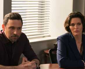 Isobel and Jubal sitting at a table together in FBI