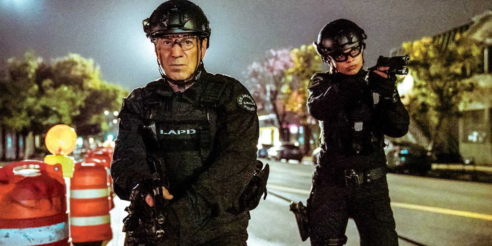 Peter Onorati in SWAT holding a gun and wearing protective gear on a mission