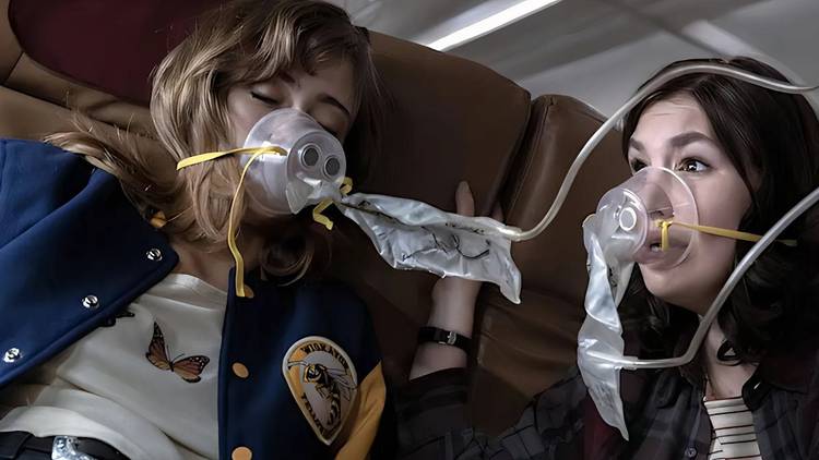 Jackie and Shauna with oxygen masks on as the plane crashes in Yellowjackets