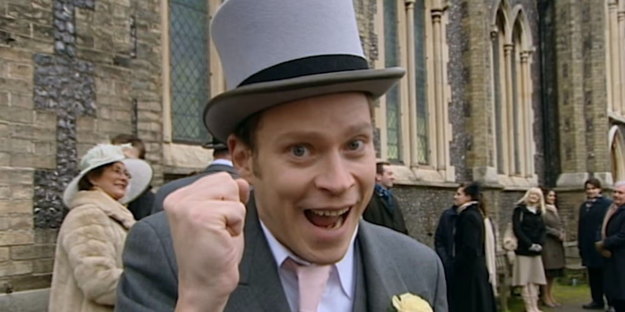 Jeremy doing the El Dude Brothers sign at Mark's wedding in Peep Show