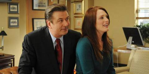 Jack Donaghy and Nancy Donovan stood smiling in 30 Rock