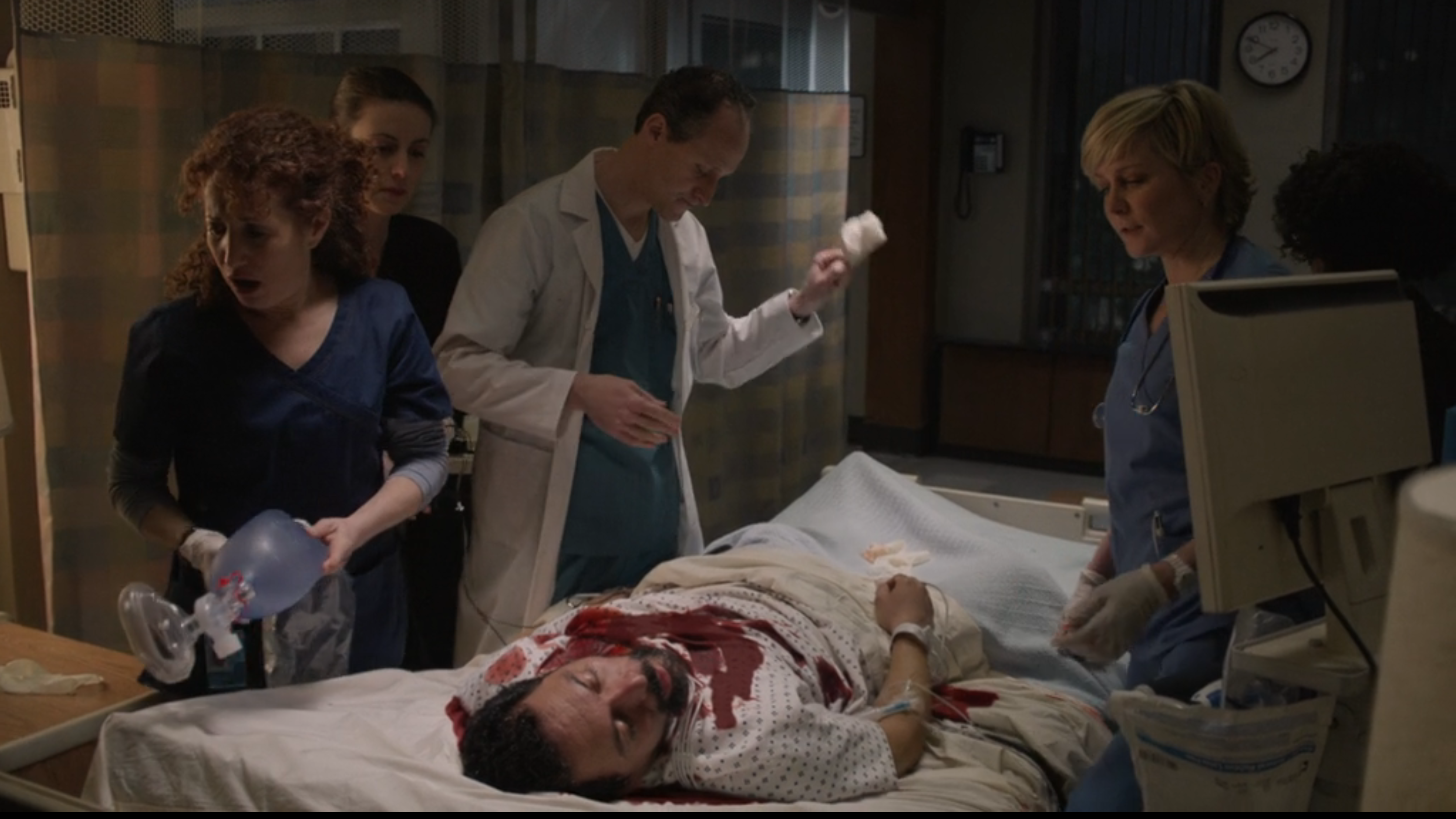 Blue Bloods Linda standing next to a patient with blood all ove rhim