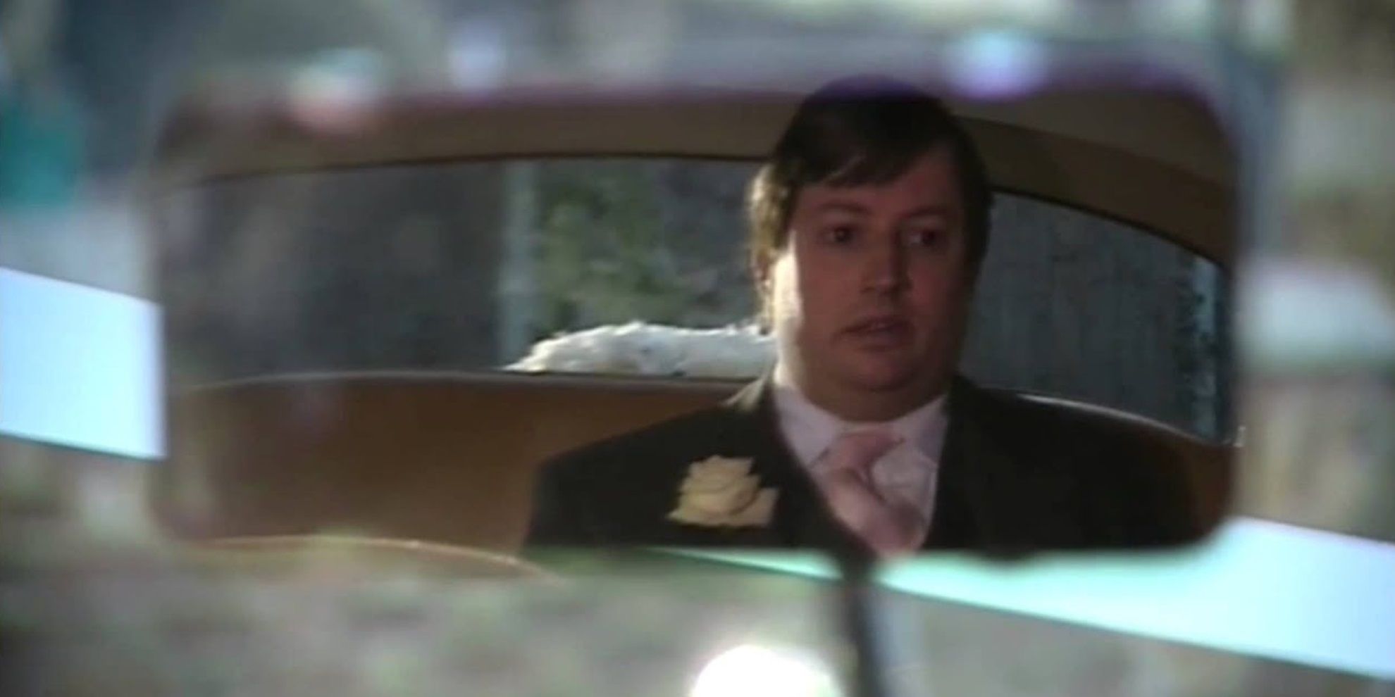 Mark in a rearview mirror in Peep Show