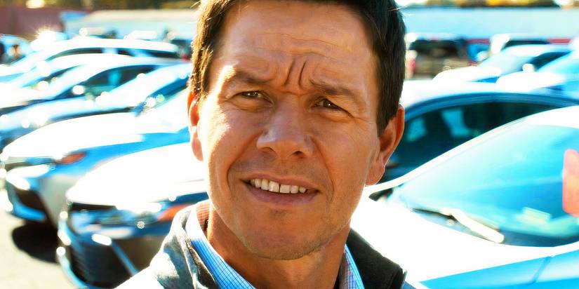 Mark Wahlberg smiling as Dan Morgan in The Family Plan
