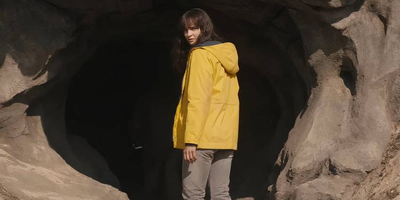Martha looking back from the cave entrance in Dark.
