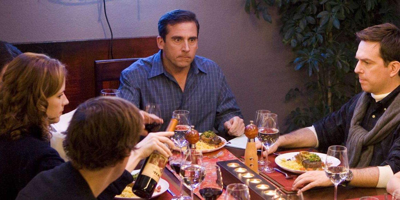 Michael sits at the head of the table in The Office 'Dinner Party'