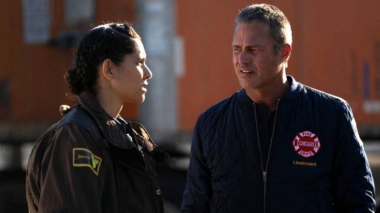 Kidd and Severide standing outside Firehouse 51 talking on Chicago Fire