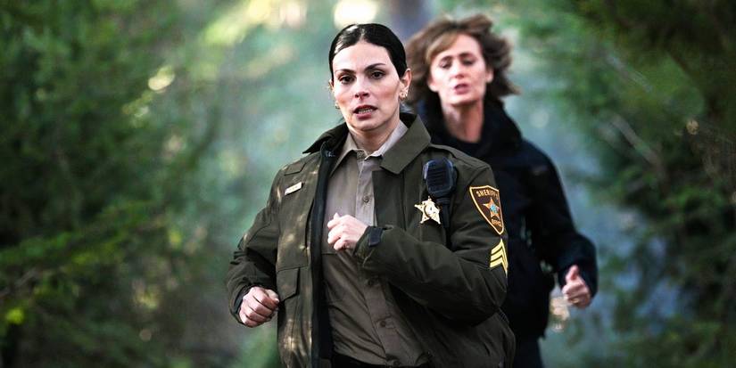 Morena Baccarin runs through the woods in Fire Country