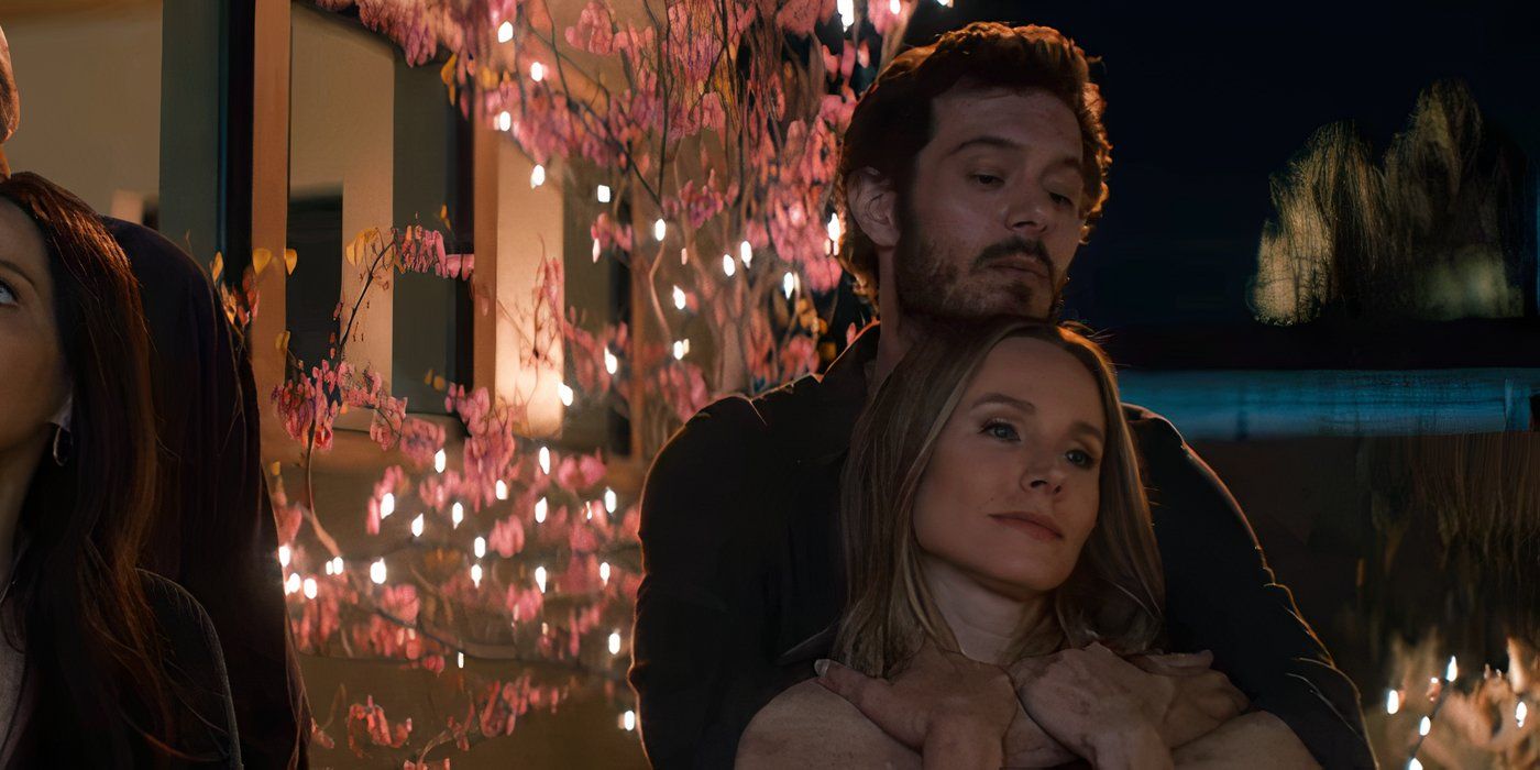 Noah and Joanne, played by actors Adam Brody and Kristen Bell, hug in the Netflix show Nobody Wants This. 