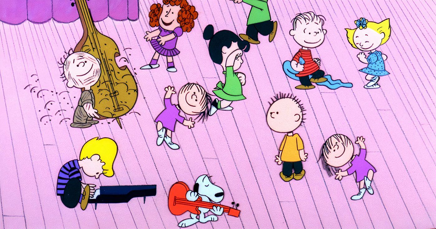 A turma do Peanuts dançando e tocando instrumentos.