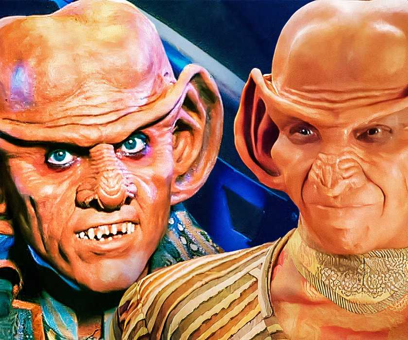 Deep Space Nine, both Ferengi smiling at the camera on a blue background.