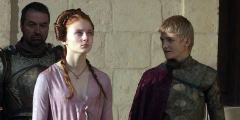 Sansa (Sophie Turner) and Joffrey (Jack Gleeson) looking at Ned's head in Game of Thrones season 1