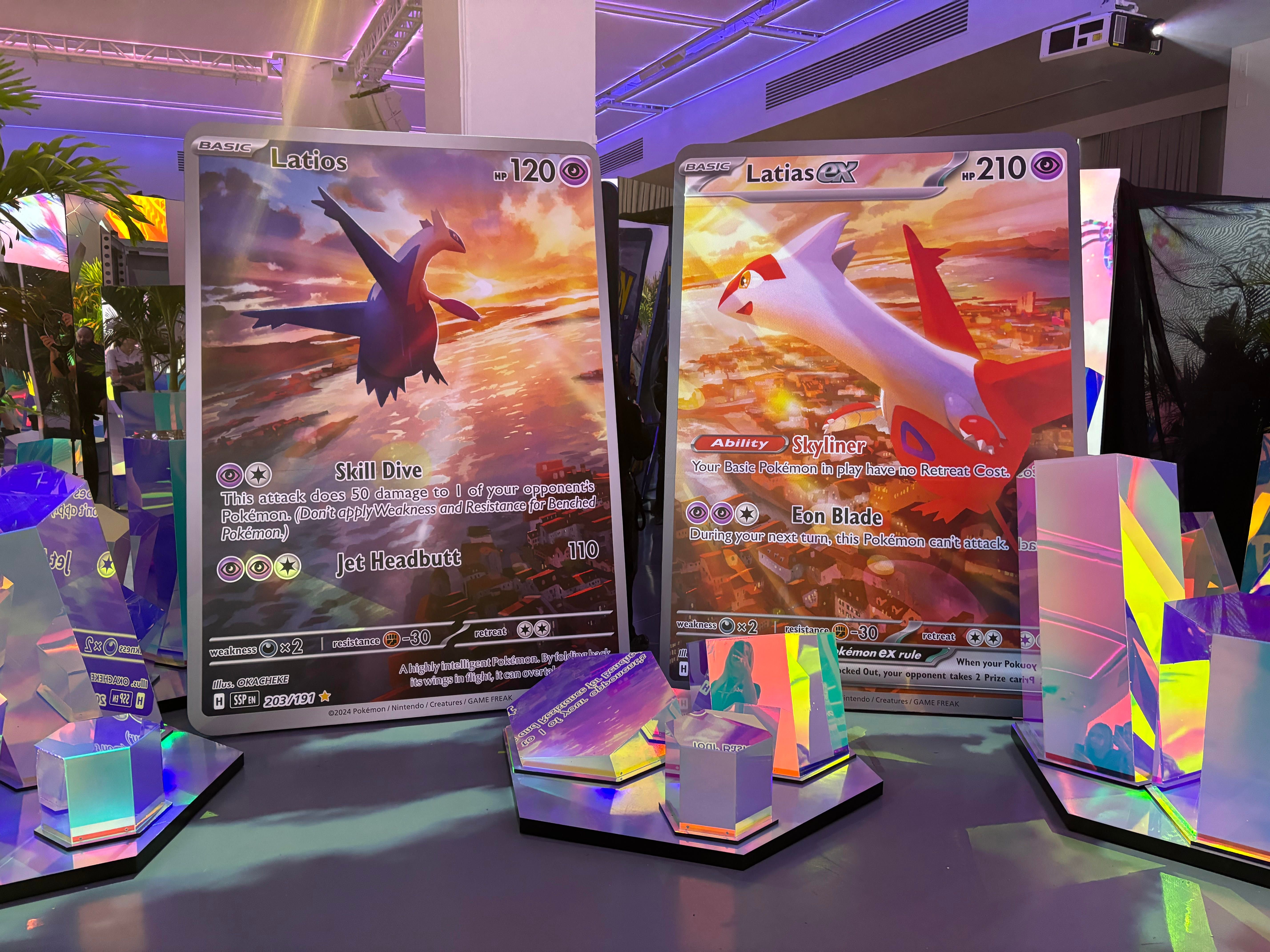 Stellar Maze Latios and Latias card displays showing large versions of the two cards next to each other surrounded by crystal statues.