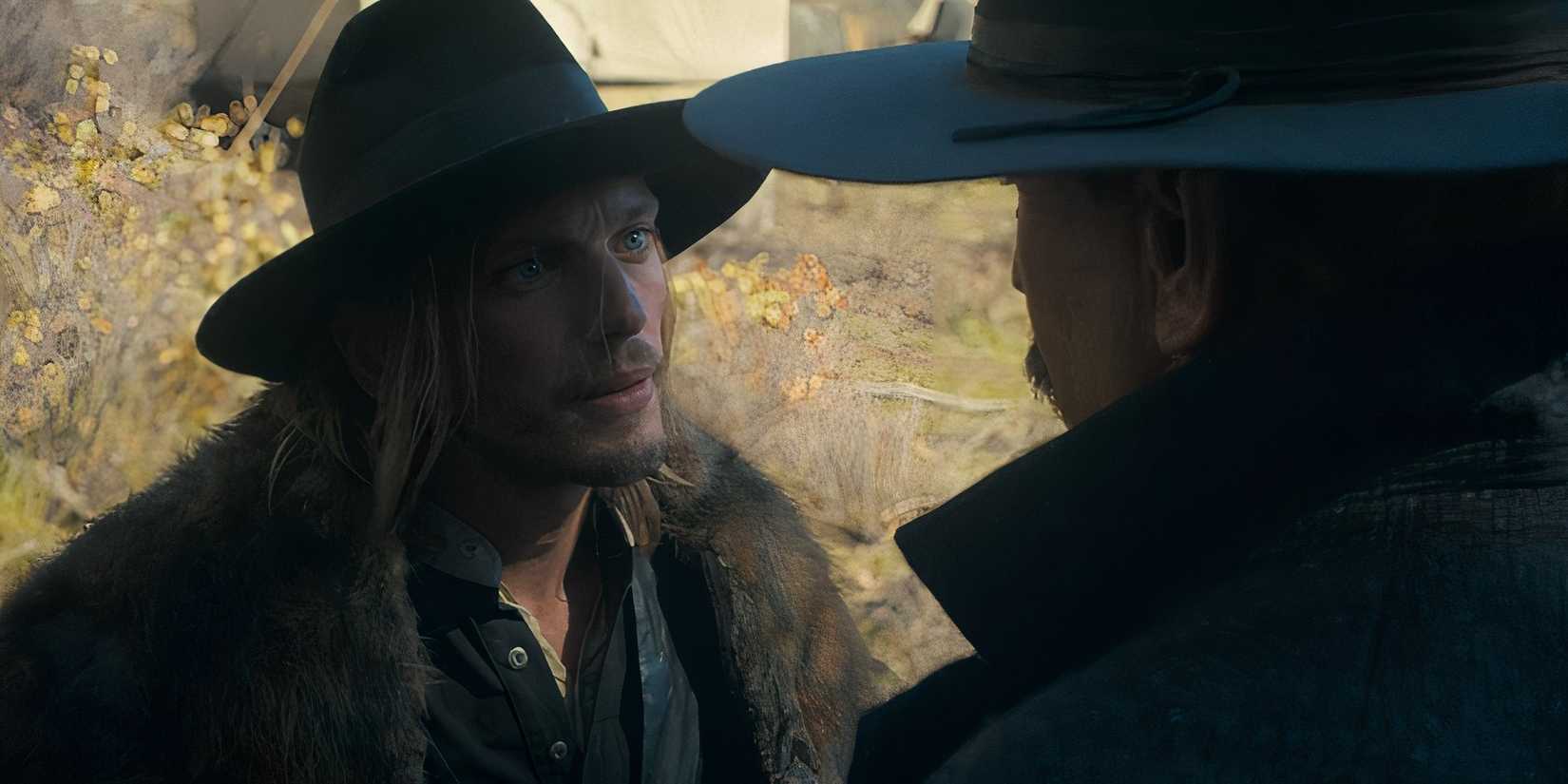 Caleb Sykes (Jamie Campbell Bower) and Hayes Ellison (Kevin Costner) talking in Horizon: An American Saga - Chapter 1