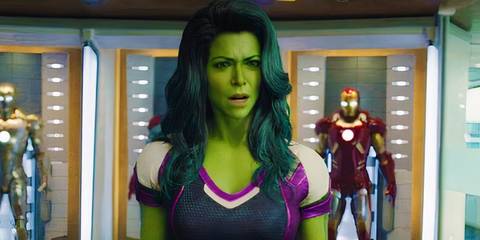 MCU's She-Hulk standing in front of Iron Man suits.