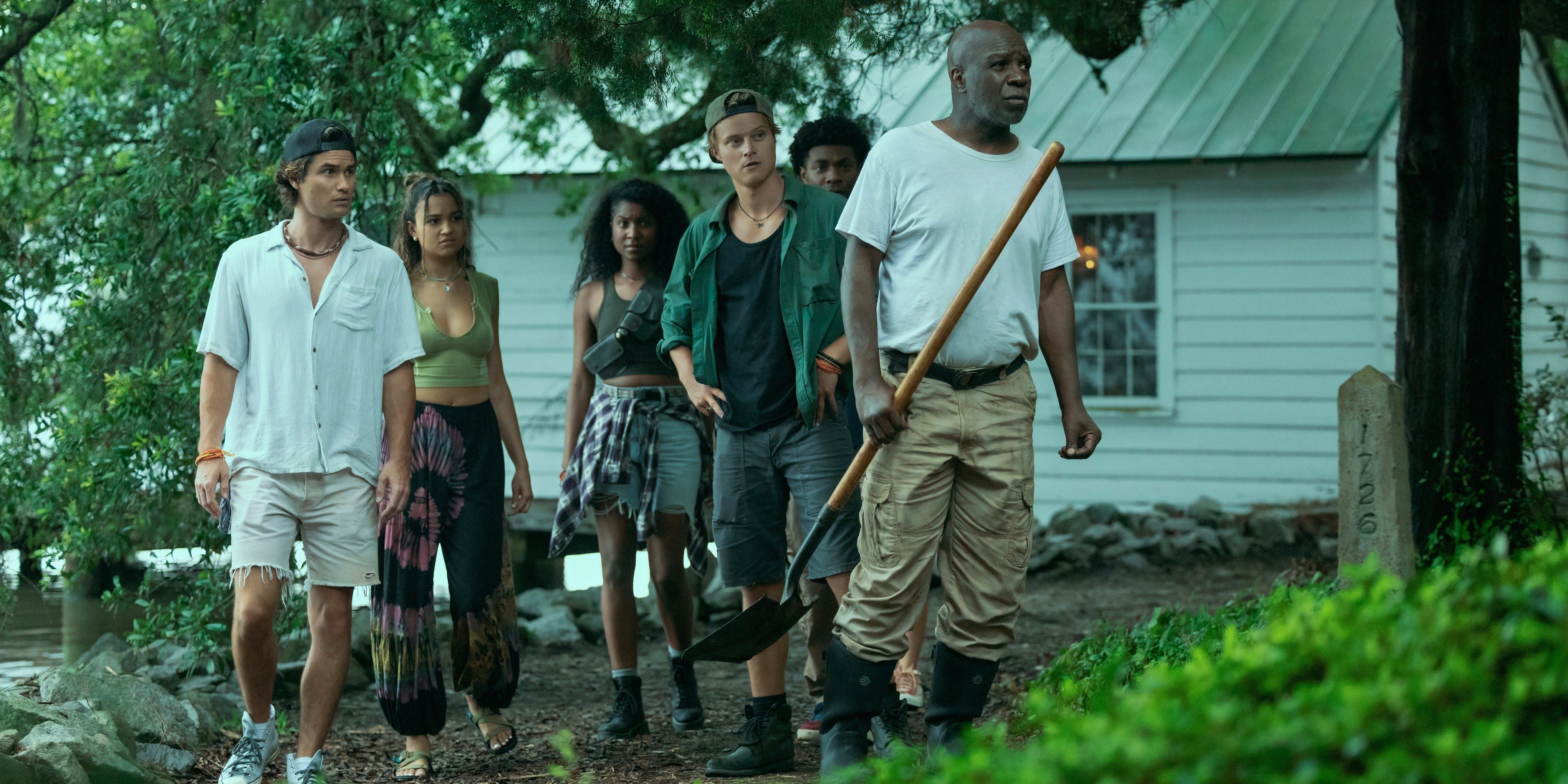 The cast of Outer Banks walks through a garden in season 4