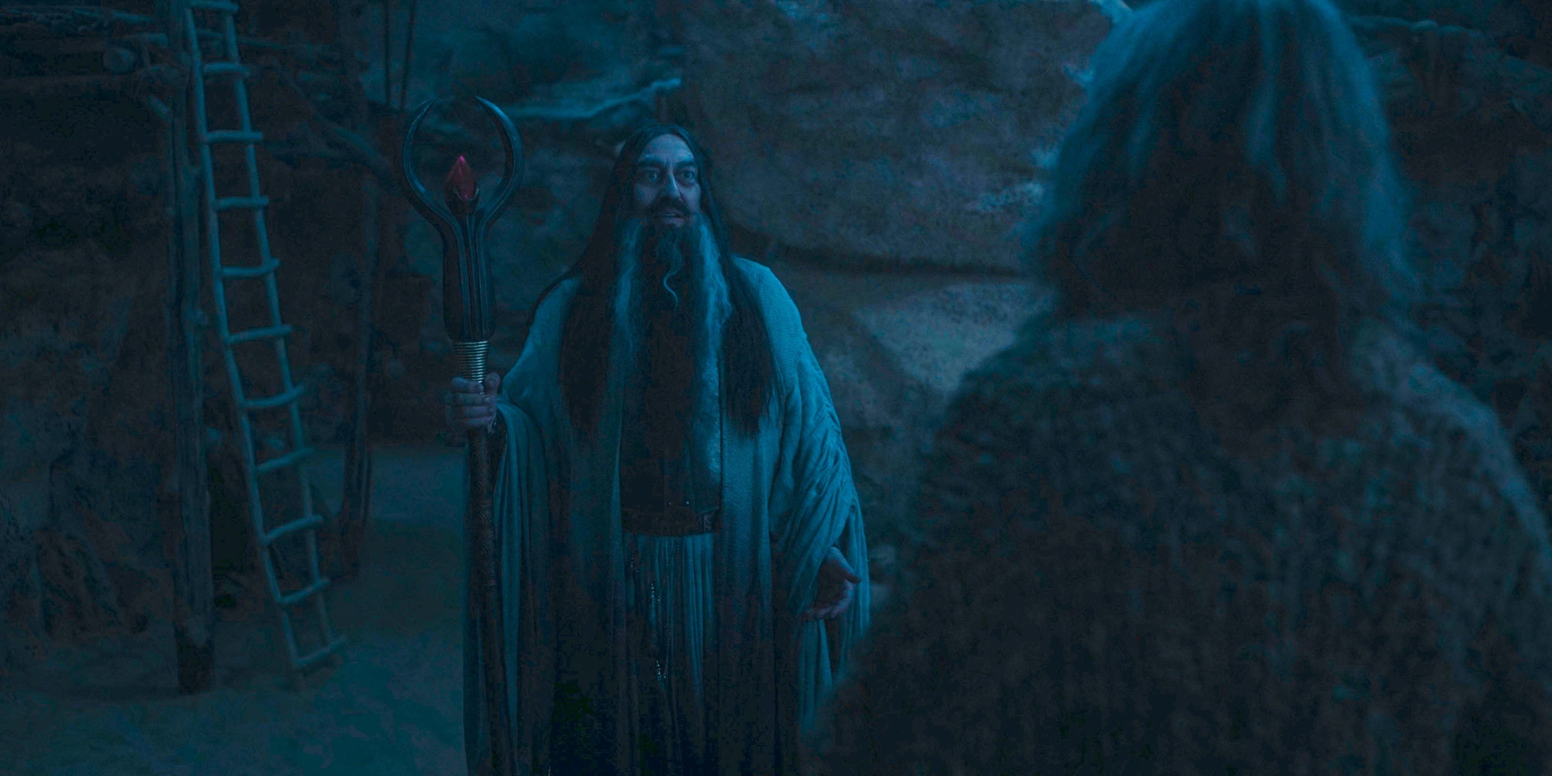 The Dark Wizard (Ciarán Hinds) encounters the Stranger in The Lord of the Rings: The Rings of Power Season 2 Episode 8