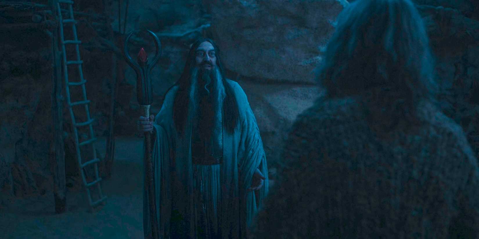 The Dark Wizard (Ciarán Hinds) encounters the Stranger in The Lord of the Rings: The Rings of Power Season 2 Episode 8