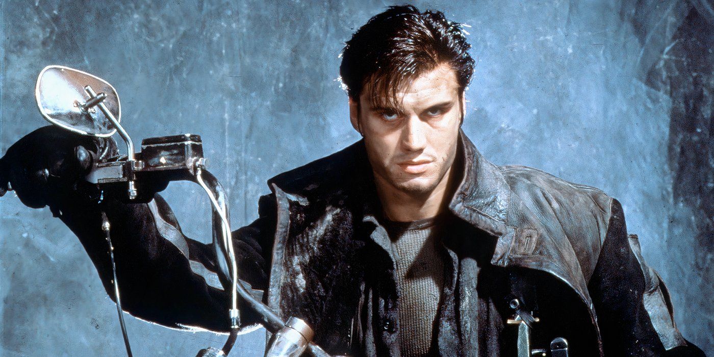 The Punisher (1989) as the Punisher with dark hair, leather jacket on a motorcycle