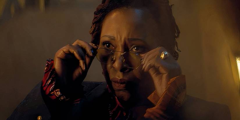 Jo Martin as the Fugitive Doctor putting on a pair of glasses in the Doctor Who Flux episode Once, Upon Time.