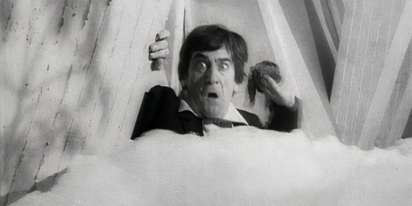 Patrick Troughton as the Second Doctor looking shocked at the Ice Warrior's pod foam in the Doctor Who serial The Seeds of Death.