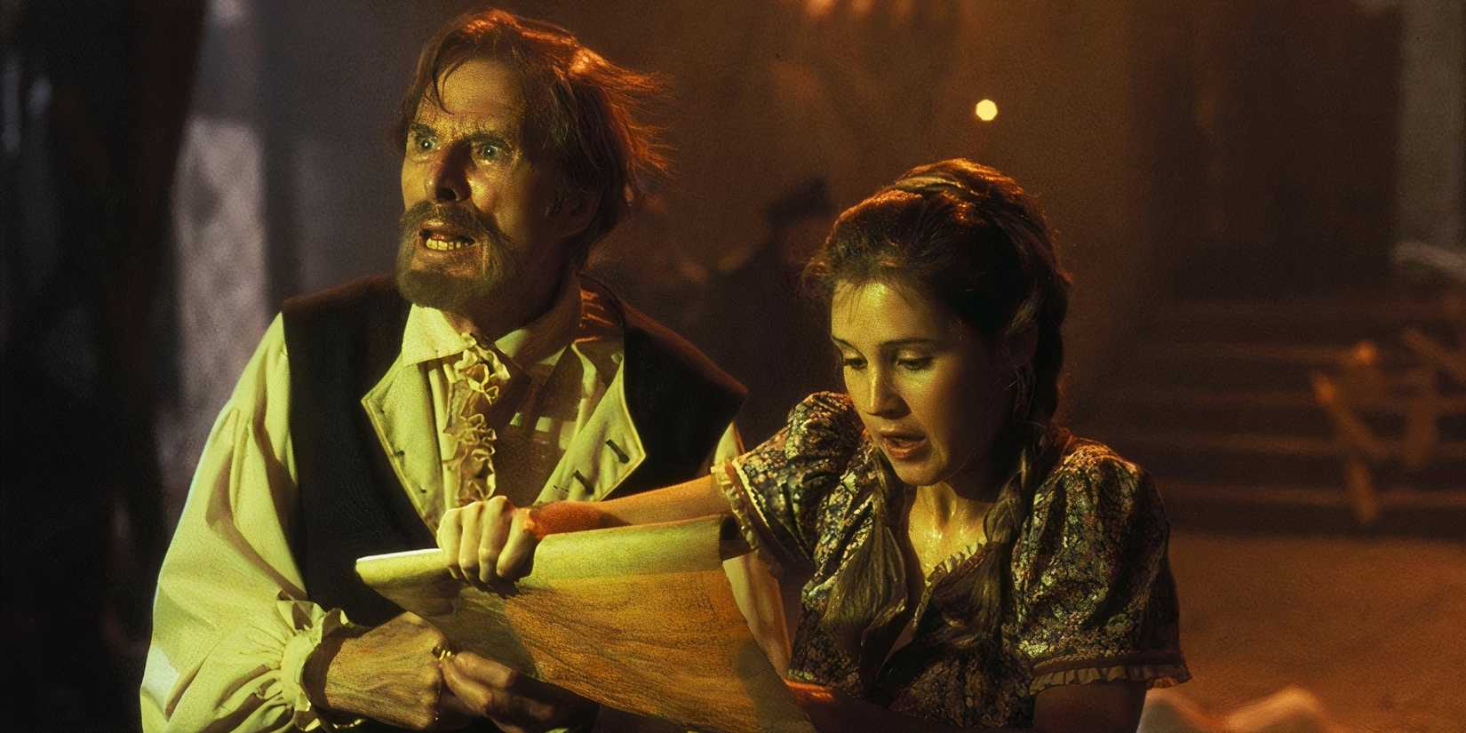 Jack Gwillim as Van Helsing looking panicked as a peasant girl reads a scroll in The Monster Squad.