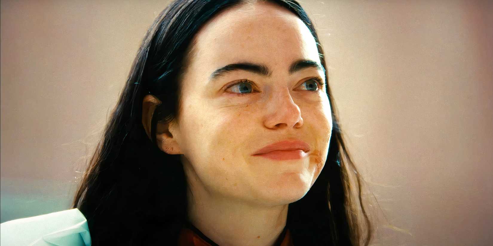 Emma Stone smiling in Poor Things