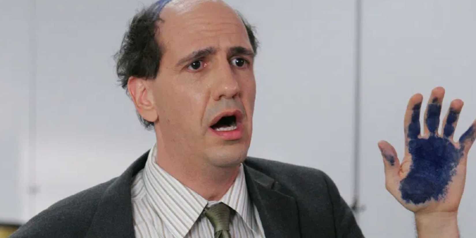 Sam Lloyd looking sad with an inky hand as Ted in Scrubs