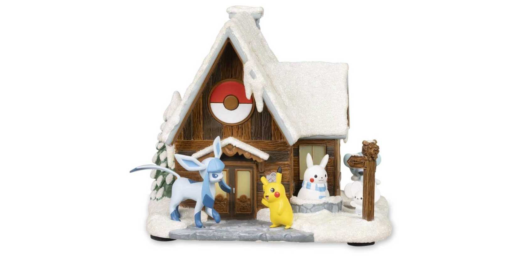 The Winter Retreat ornament with Glaceon and Pikachu next to a building from the 2024 Pokemon Holiday Collection.