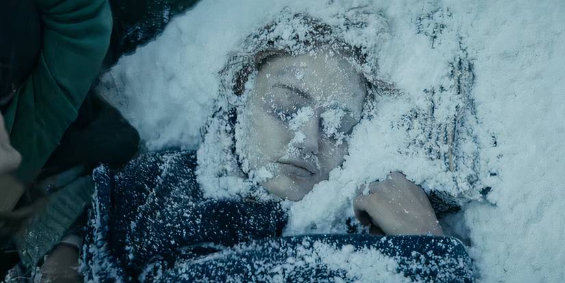 Jackie's (Ella Purnell) body in the snow in the Showtime series Yellowjackets. 