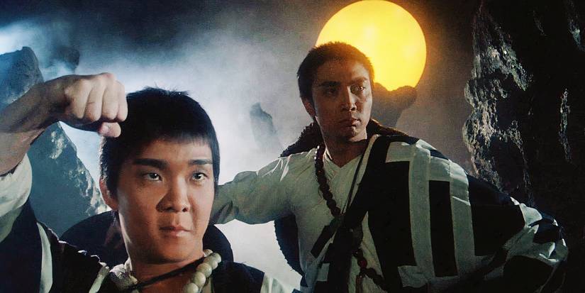 Zu- Warriors From The Magic Mountain - Two warriors in dress with the moon behind 