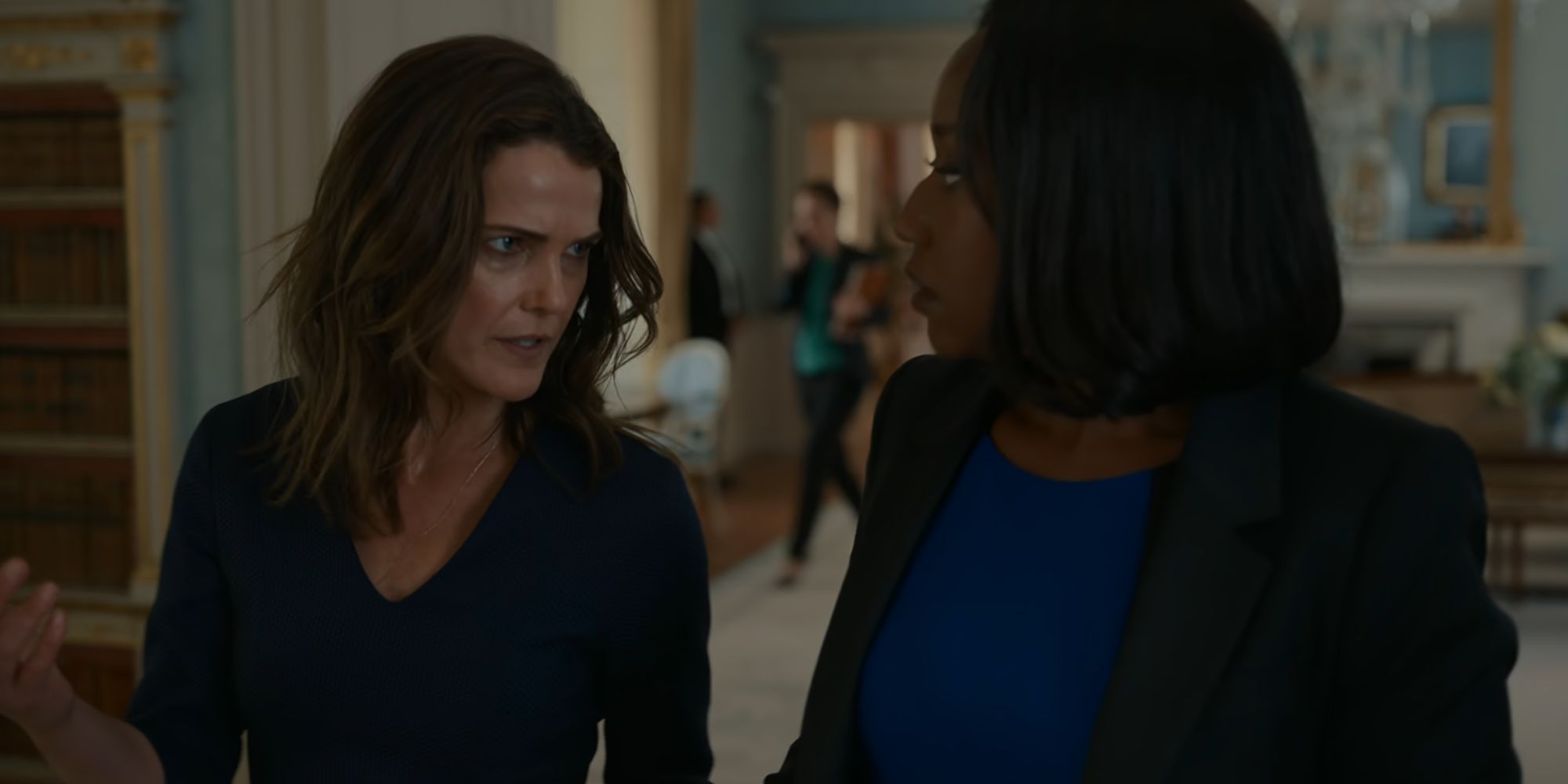 Keri Russell as Kate Wyler walking alongside Nana Mensah's Billie Appiah in The Diplomat