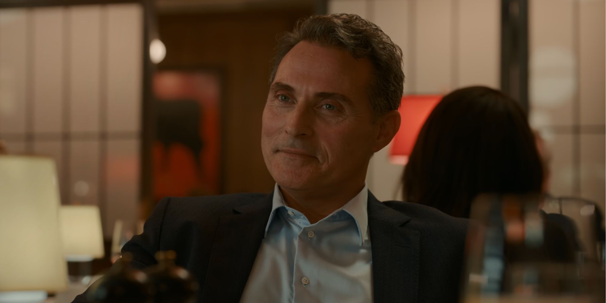 Rufus Sewell smirking as Hal Wyler in The Diplomat