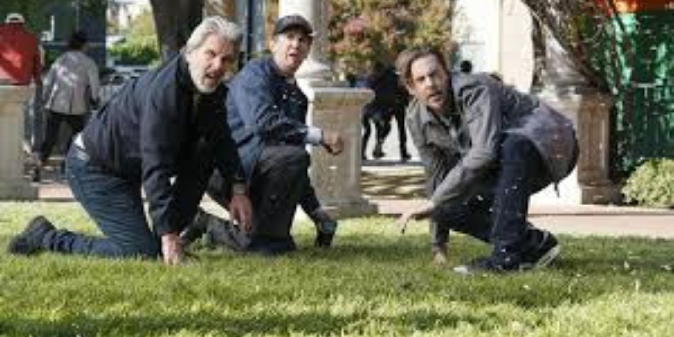 NCIS the agents kneeling and squatting to check out the grass