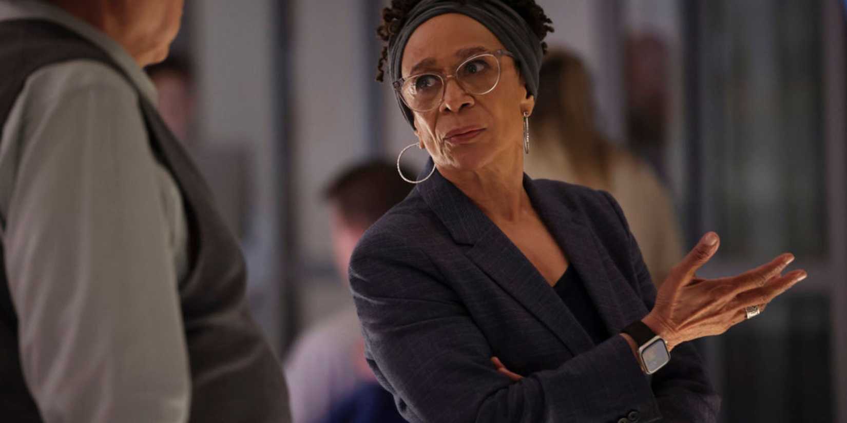 Chicago Med Sharon gesturing with her hand as she explains something to Charles