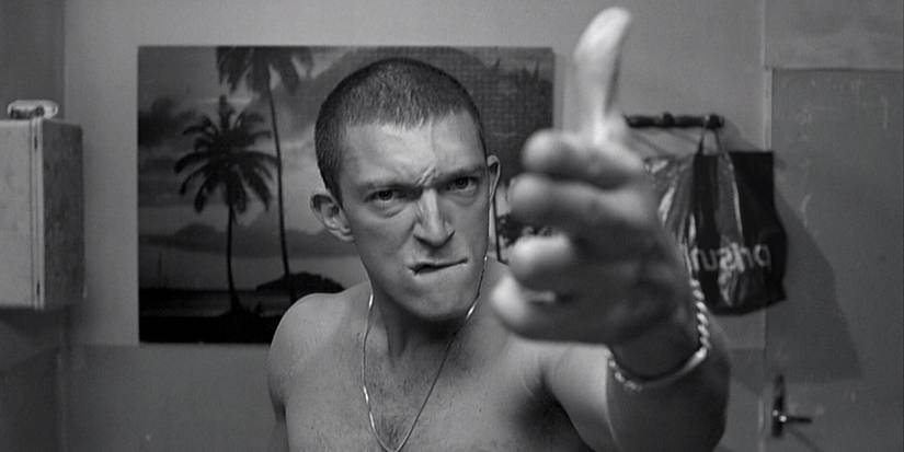 A boy poiting his fingers simulation a gun in La Haine (1995)