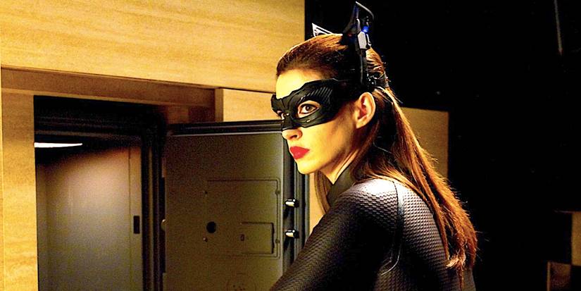 Anne Hathaway's Catwoman looks in an empty vault in The Dark Knight Rises