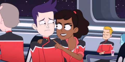 Beckett Mariner (Tawny Newsome) grins with an arm around a worried Brad Boimler (Jack Quaid) in Lower Decks Second Contact