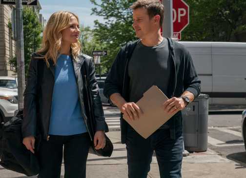 Blue Bloods Jamie and Eddie walking together down the street with a file in Jamie's hands
